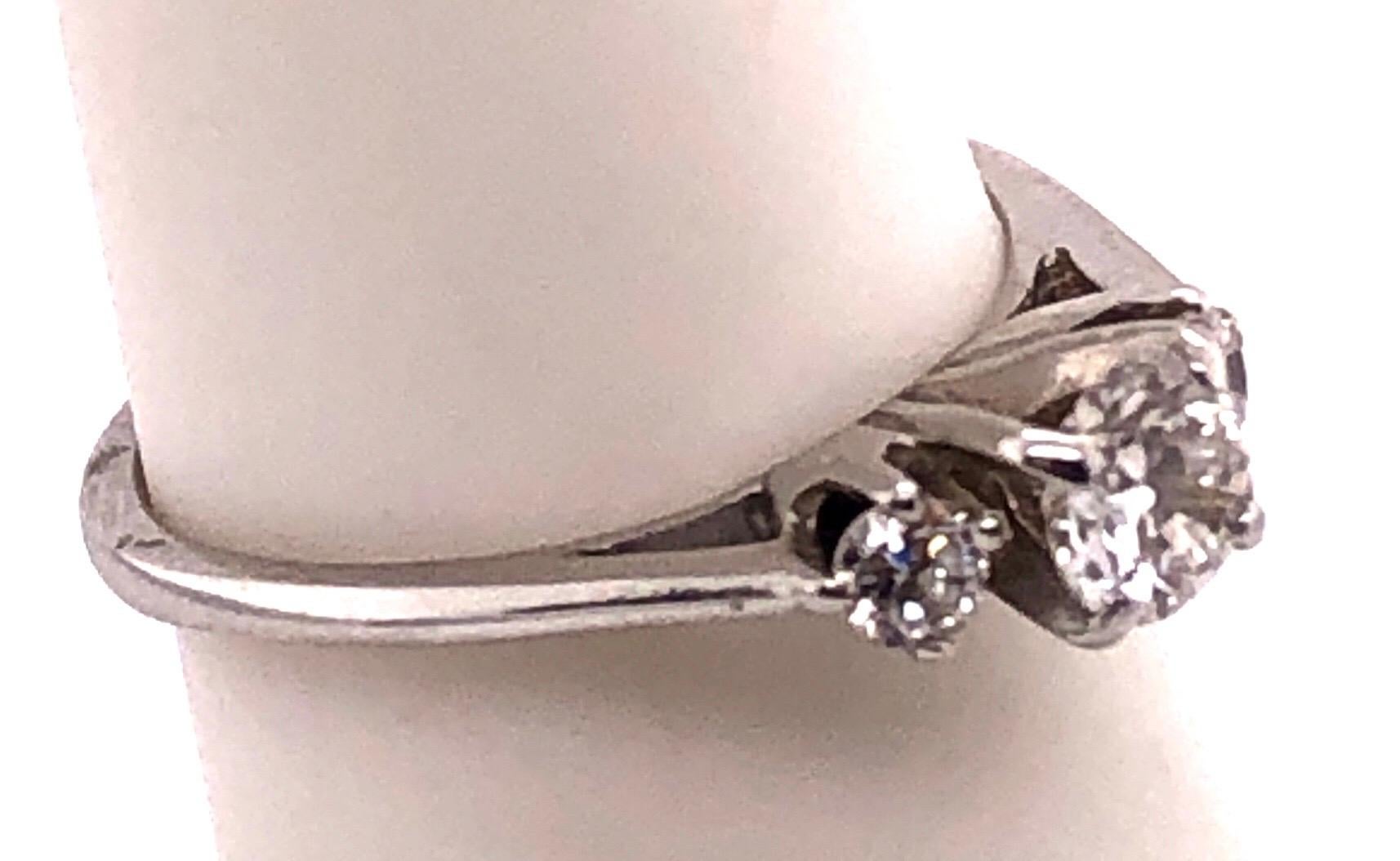 14Kt White Gold Engagement Ring 0.64 Total Diamond Weight.
Size 5.6 with 1.8 grams total weight.
