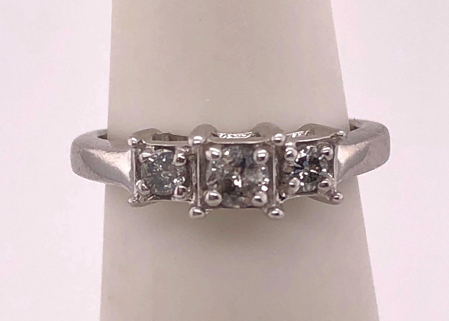 14Kt White Gold Engagement Ring/Band Ring 0.78 Total Diamond Weight.
Size 3.75 with 2.58 grams total weight.