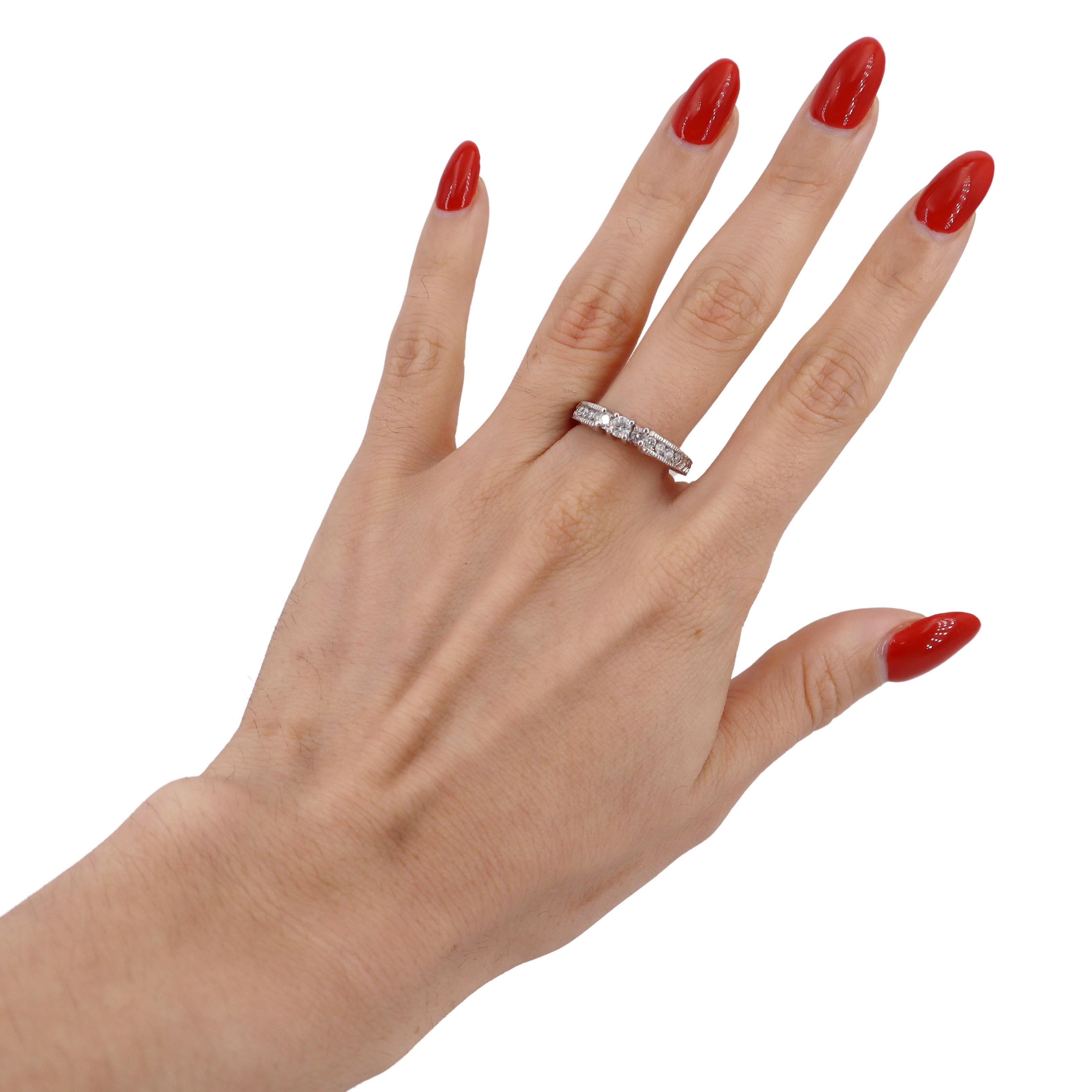 Introducing a stunning Contemporary 14kt White Gold Engagement Ring that perfectly embodies modern elegance and timeless beauty. At its heart lies a brilliant Round Cut Diamond, approximately 0.15 carats, radiating a striking H color and SI2 clarity