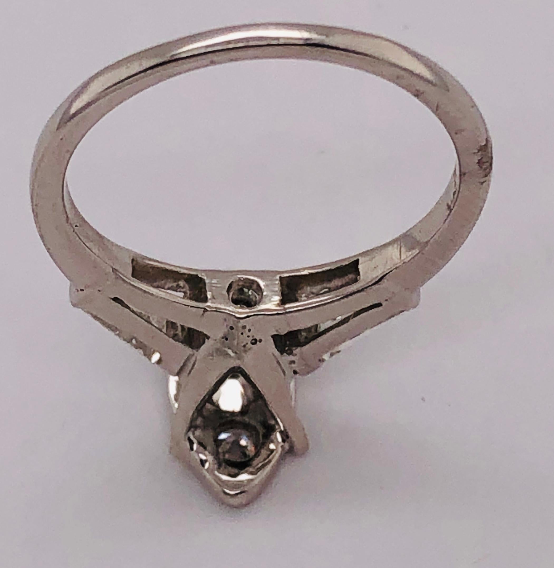 14 Karat White Gold Engagement Ring with Round and Baguette Cut Diamonds For Sale 7