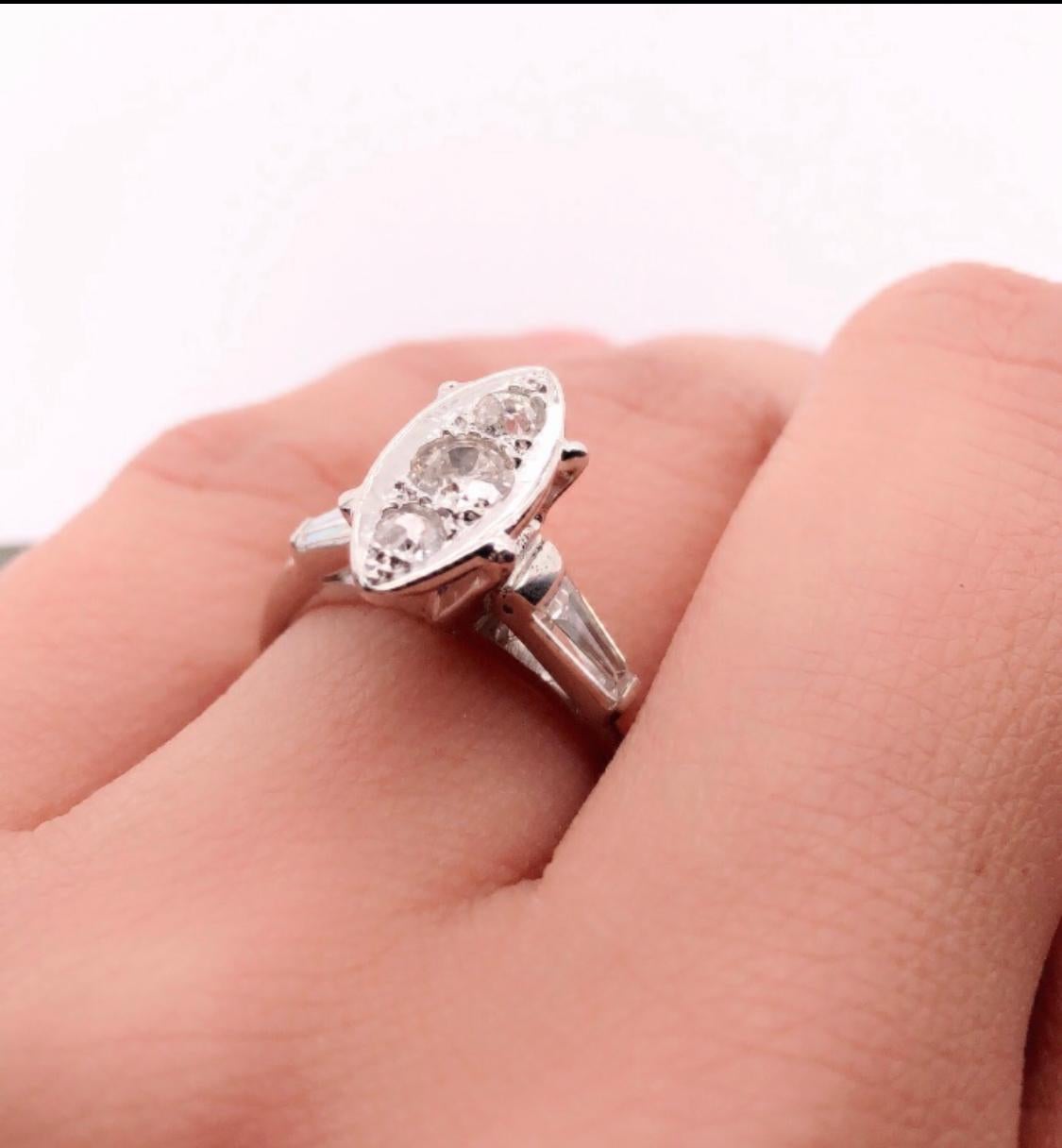 Round Cut 14 Karat White Gold Engagement Ring with Round and Baguette Cut Diamonds For Sale