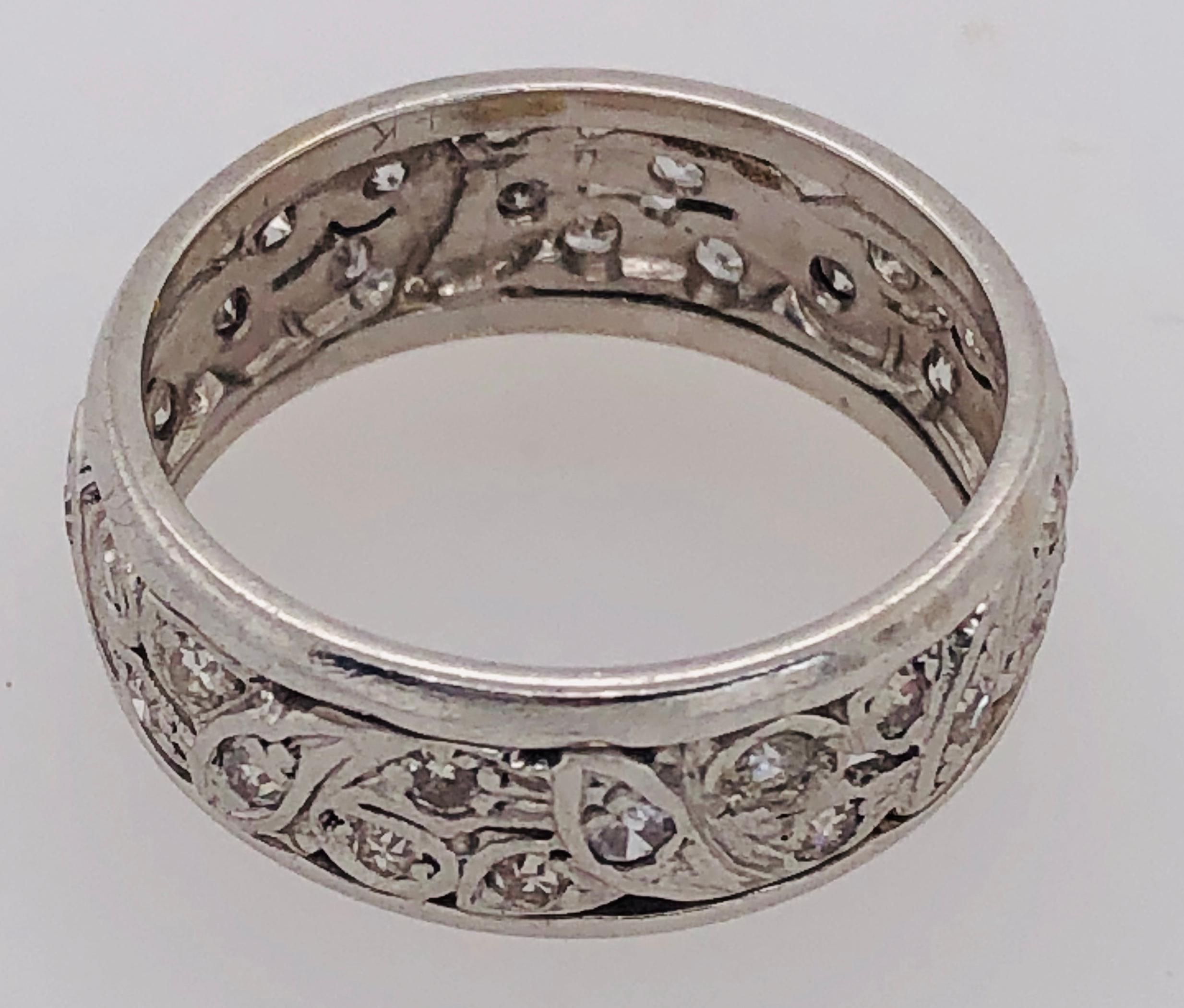 4Kt White Gold Eternity Wedding Band or Fashion Ring 
Size 6.55
1 Ct Total Diamond Weight.   
5.5 grams total weight.
