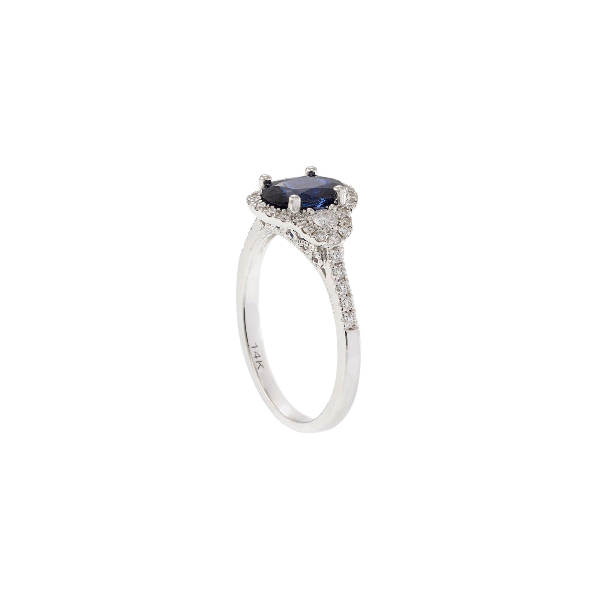 Oval Cut 14KT White Gold Halo Ring Featuring Oval Sapphire & Diamonds For Sale