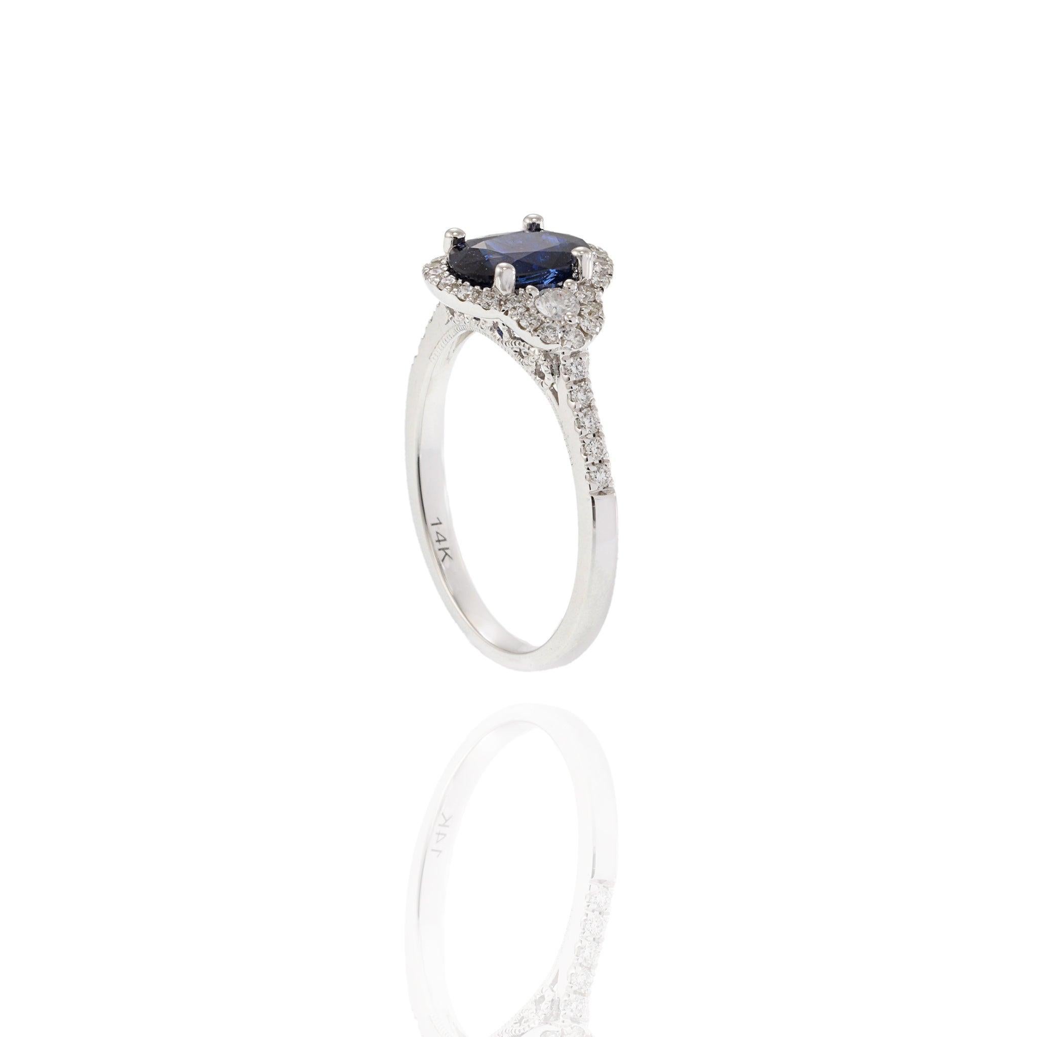 Women's 14KT White Gold Halo Ring Featuring Oval Sapphire & Diamonds For Sale