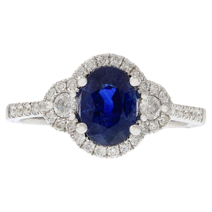 14KT White Gold Halo Ring Featuring Oval Sapphire & Diamonds For Sale