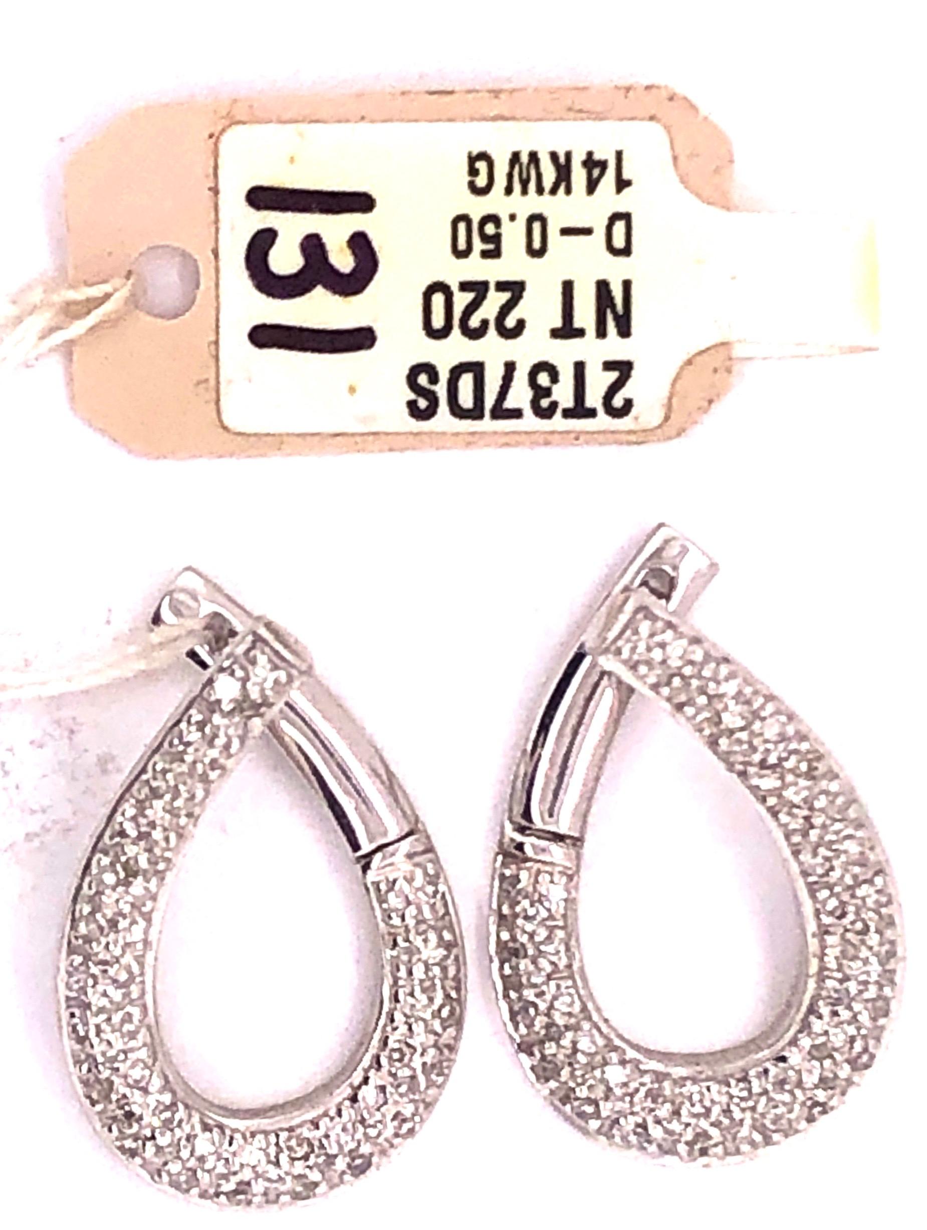 14Kt White Gold Latch Back Earrings with .50 Total Diamond Weight. Total Gold Weight 5.6 Grams.

