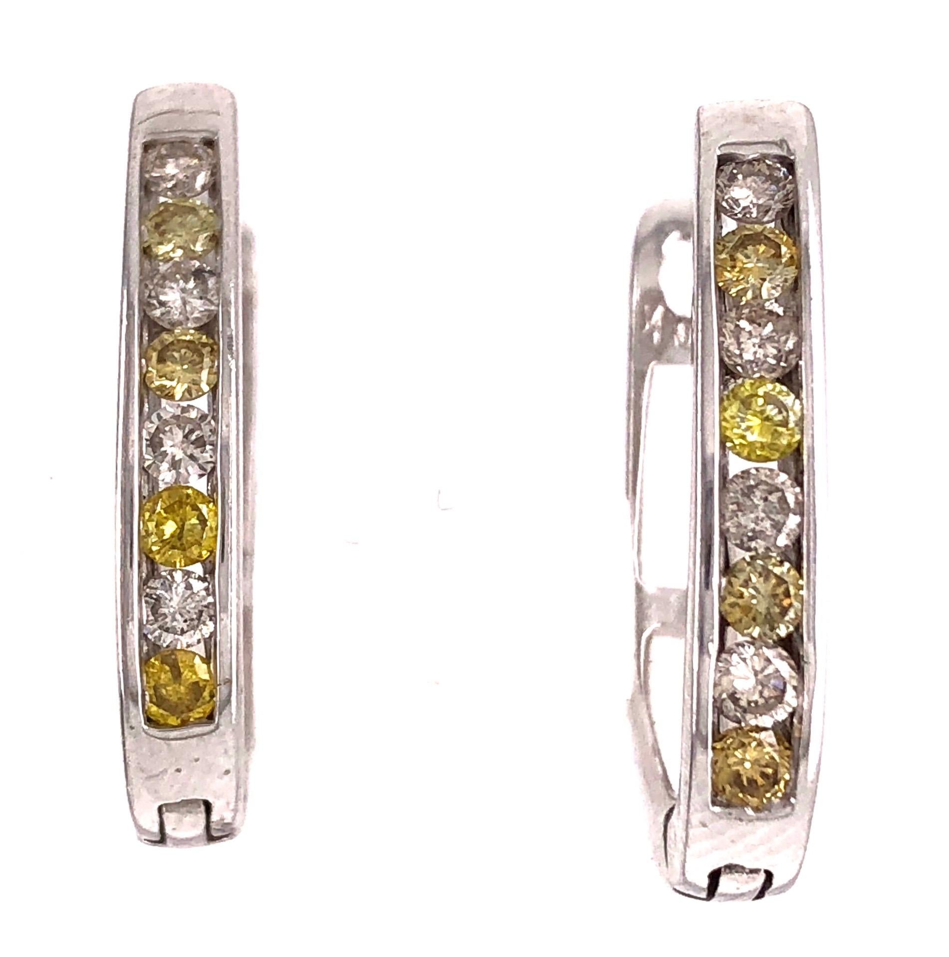 Latch Back Earrings with White and Yellow Diamonds 4.6 grams total weight. 14Kt White Gold 16 Total Diamonds .30

