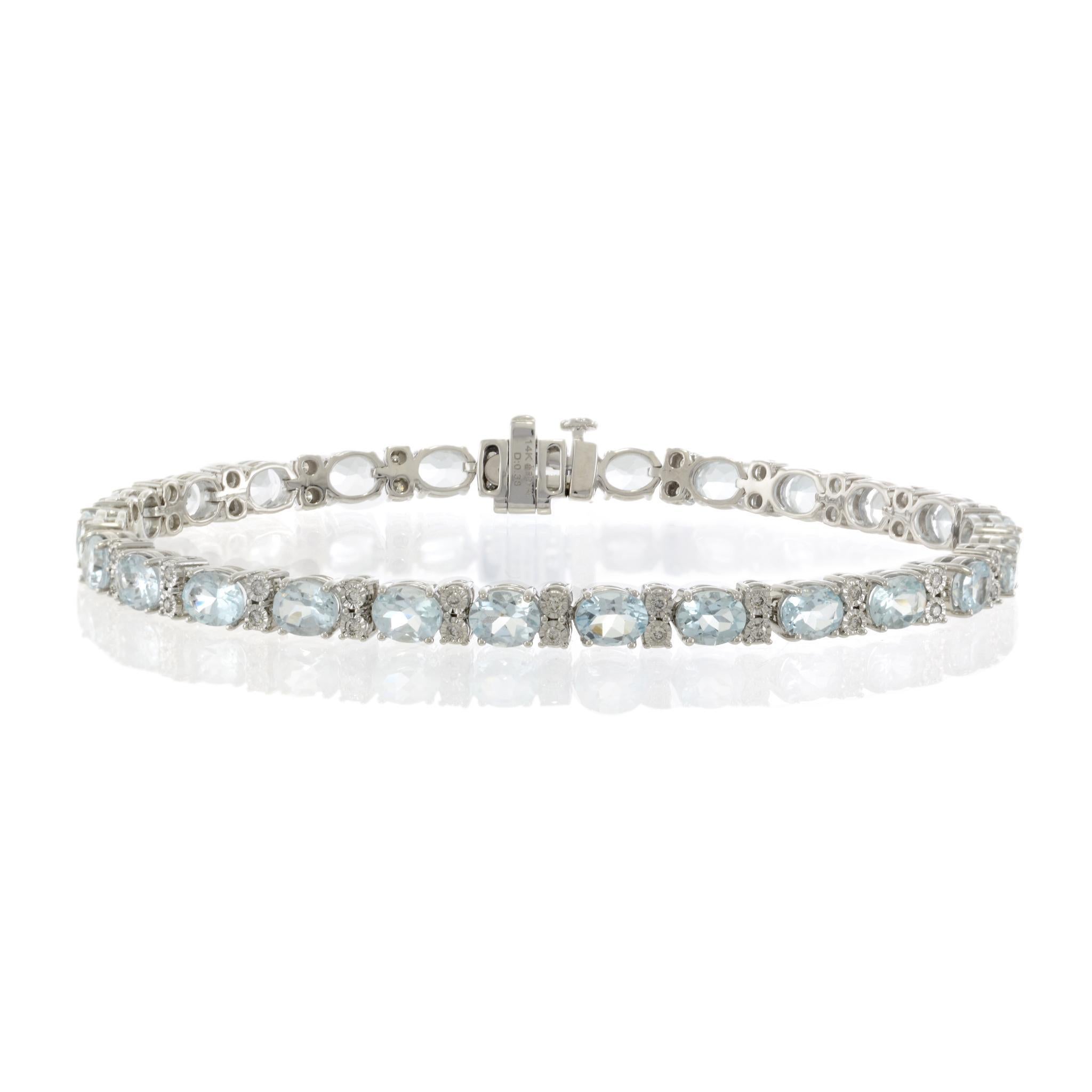 This 14KT white gold bracelet showcases 7.75CT-TW of oval-cut aquamarines, each displaying a vibrant, icy blue hue. Complementing the aquamarines are 0.38CT-TW of round-cut diamonds (G-H/SI clarity), adding brilliance and contrast. Weighing 11.72