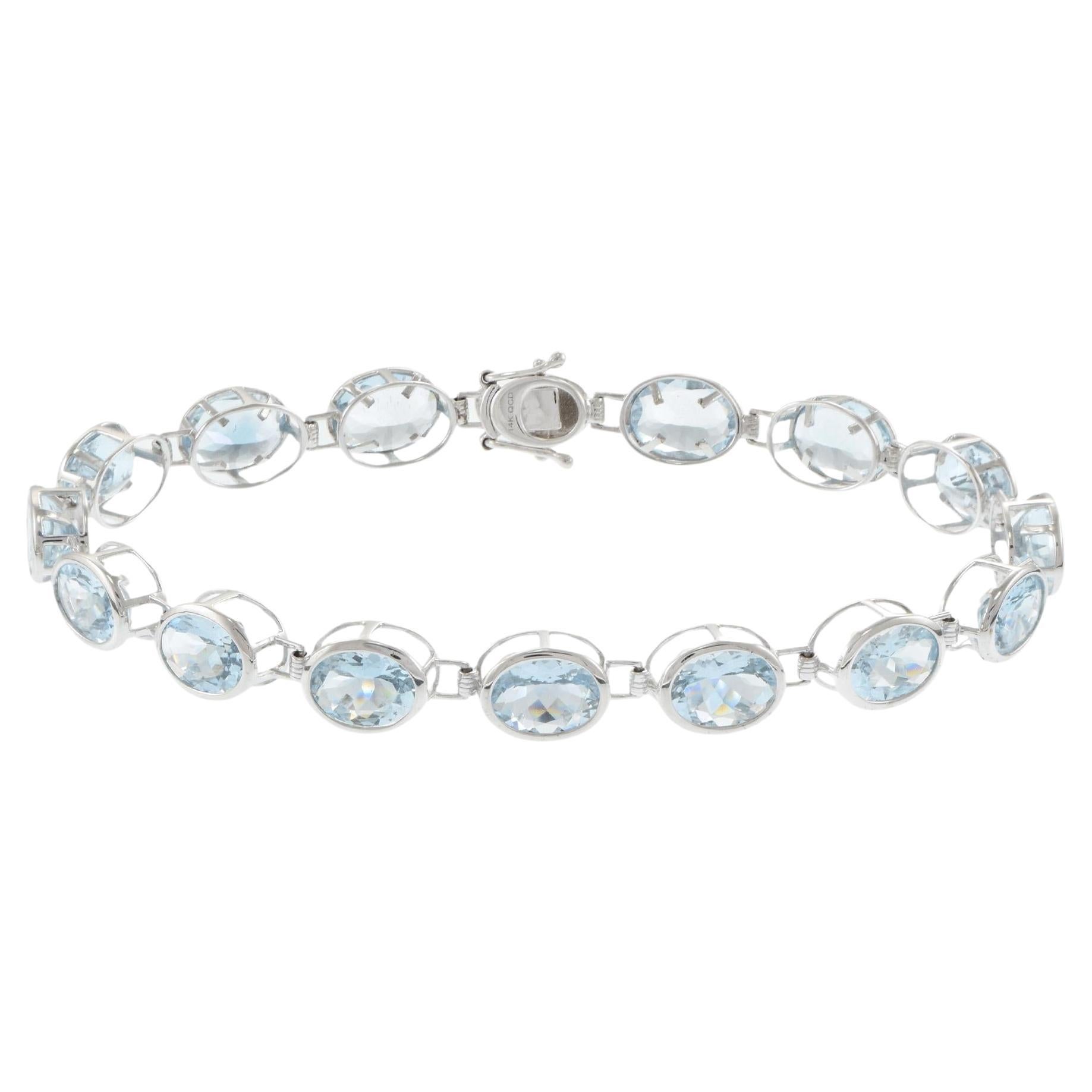 Pulsera de tenis de aguamarina ovalada de oro blanco de 14 quilates en venta