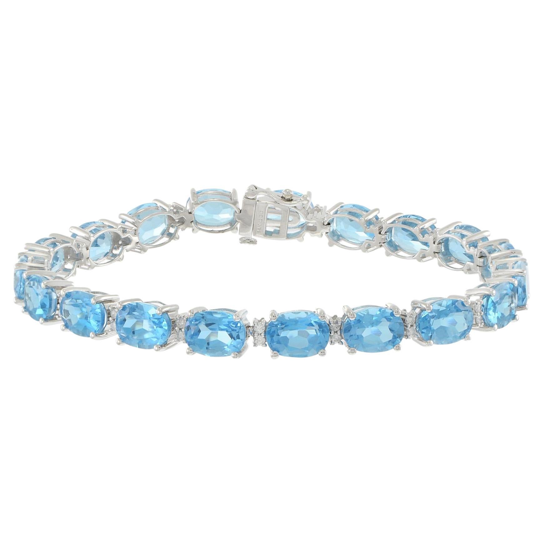 Bracciale in oro bianco 14KT con topazio blu ovale e diamanti in vendita