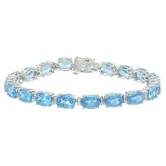 Bracciale in oro bianco 14KT con topazio blu ovale e diamanti