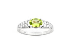 14KT White Gold Oval Peridot and Diamond Ring