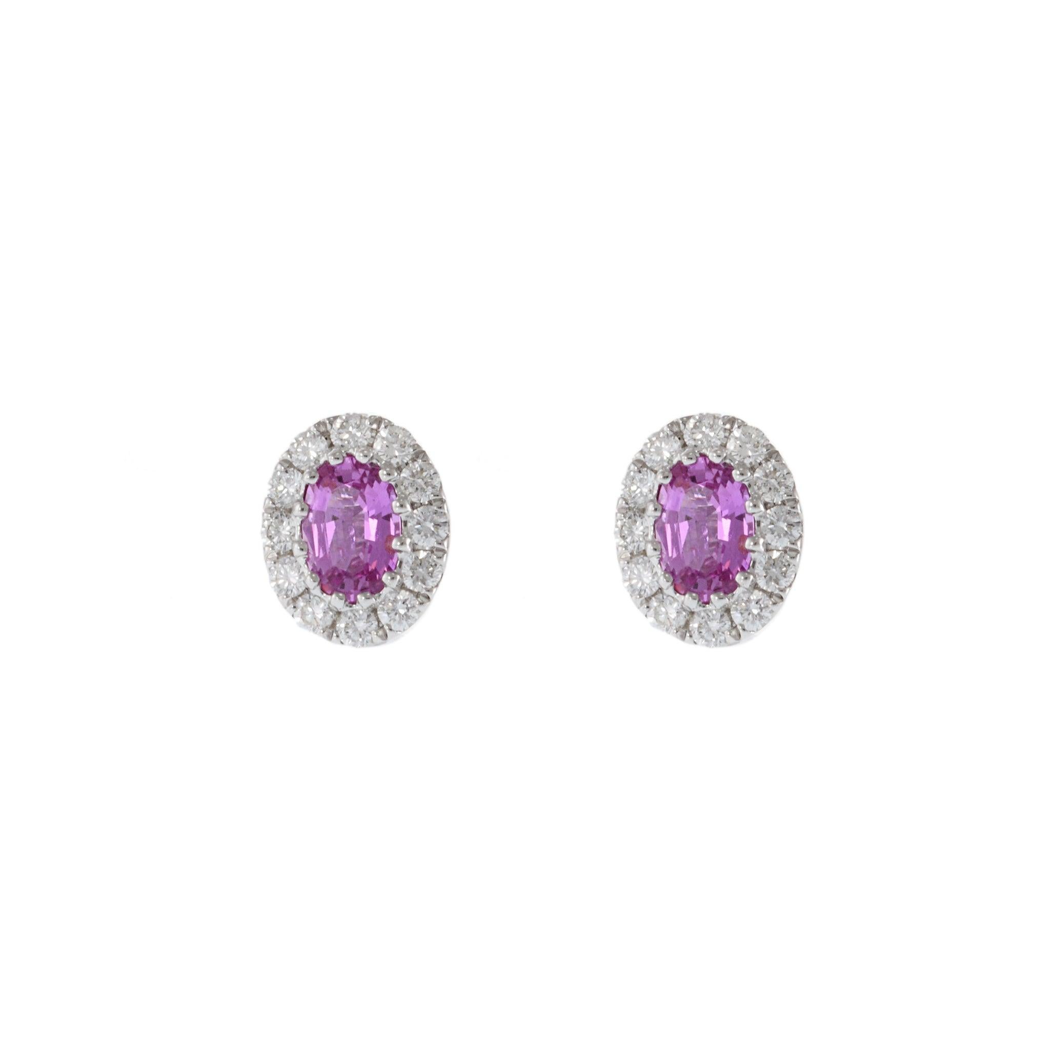 These stunning earrings feature 1.17 carats of oval pink sapphires, set in 14KT white gold. The sapphires are beautifully complemented by 0.49 carats of round cut diamonds with VS clarity, adding a touch of brilliance and elegance to the design.
