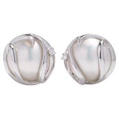 Retro 14kt. white gold pair of Mabe pearl and diamond earrings 