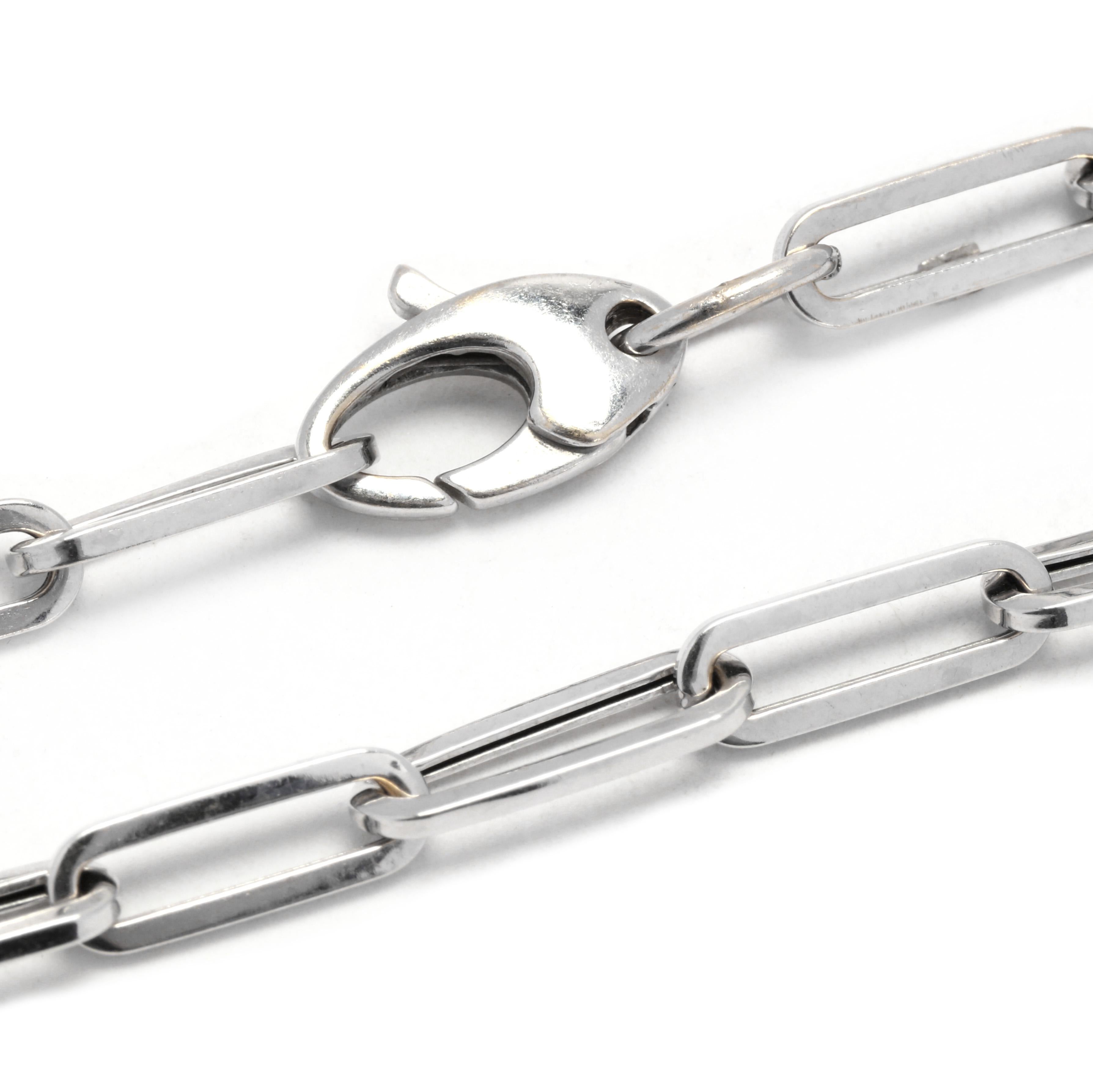 A 14 karat white gold paperclip chain bracelet. This minimalist chain bracelet features medium size, oblong oval link and with a lobster clasp.

Length: 6 7/8 in.

Width: 3/16 in.

Weight: 1.7 dwts. / 2.6 grams

Stamps: 14K

Ring Sizings &