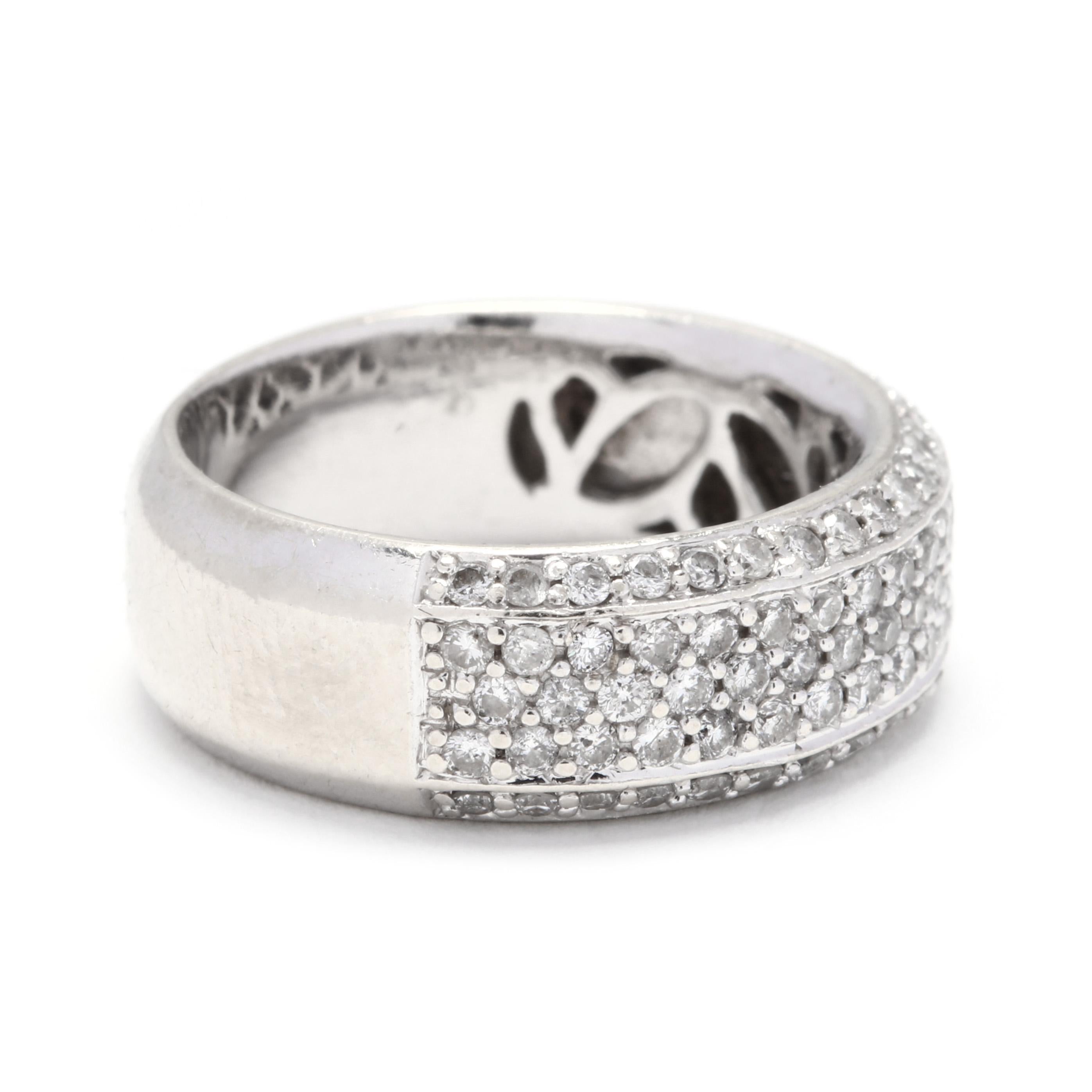 A 14 karat white gold and pavé diamond band ring. A wide band ring with beveled edges, with pavé set full cut round diamonds weighing approximately 1 total carats. A classic fashion statement or anniversary band!

Stones:
- diamonds, 94 stones
-