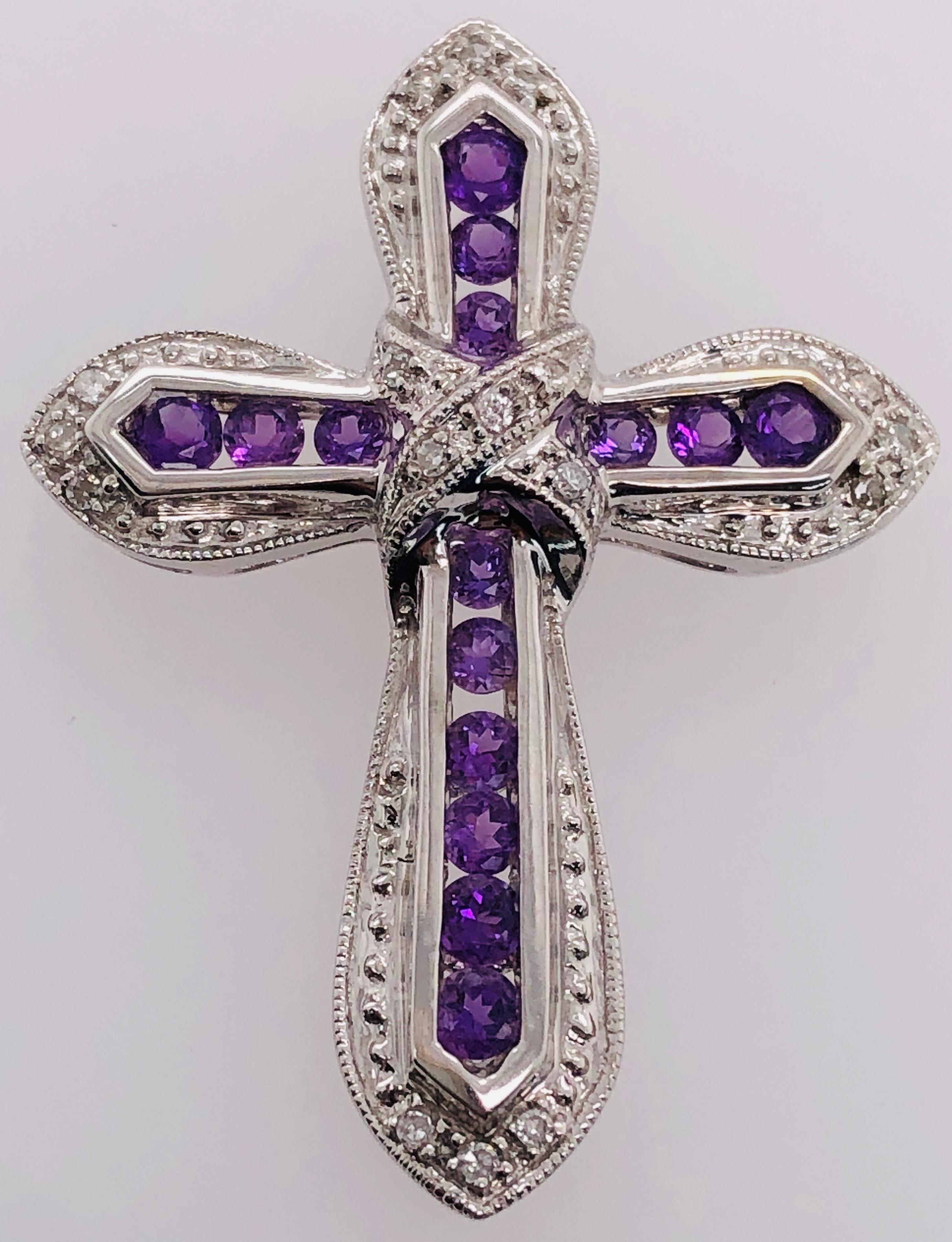 14Kt White Gold Pendant with Amethysts and Diamonds
3.76 grams Total weight. 25 by 33 MM