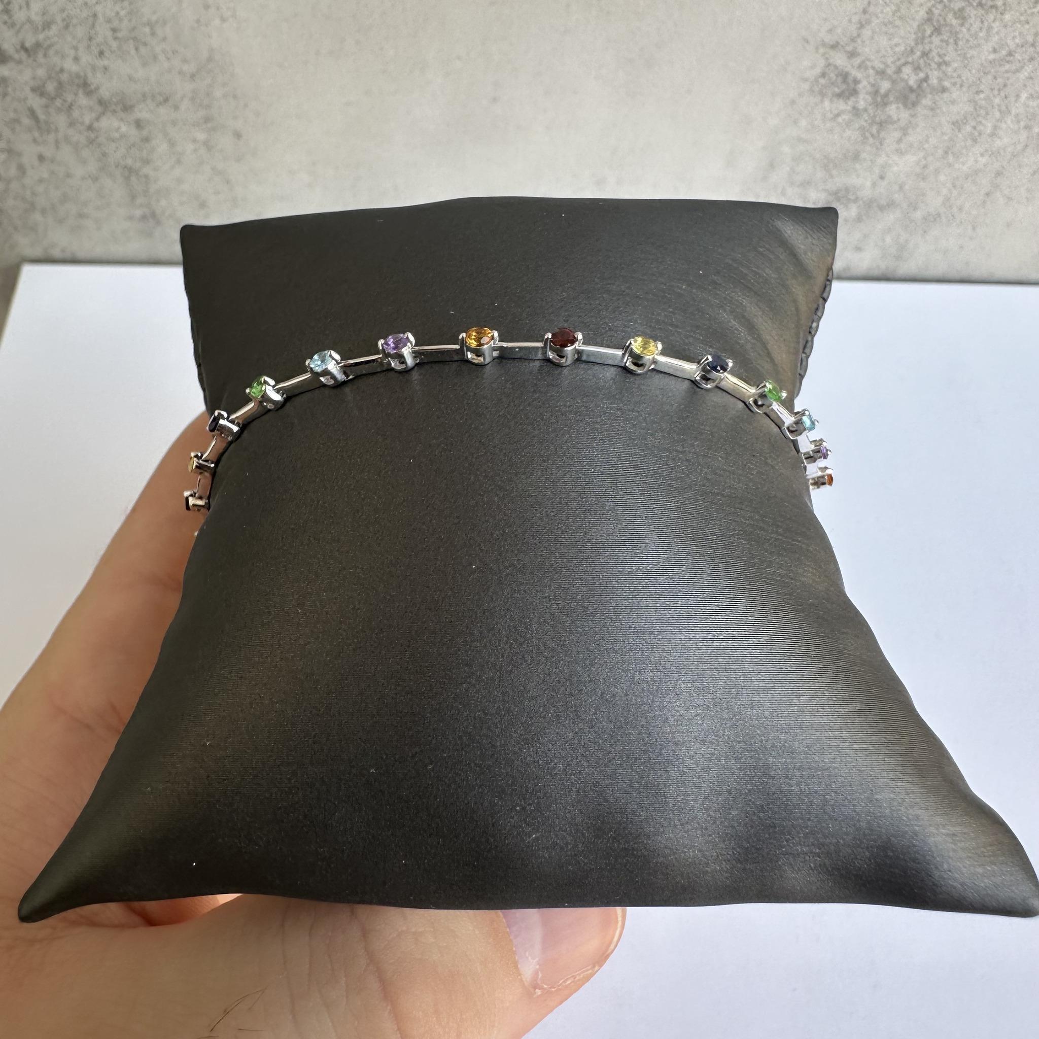 Add a burst of color to your jewelry collection with this Rainbow Gemstone Bracelet in 14kt White Gold. Featuring a total of 1.46 carats of natural mixed gemstones, this bracelet showcases a vibrant array of colors that create a stunning visual