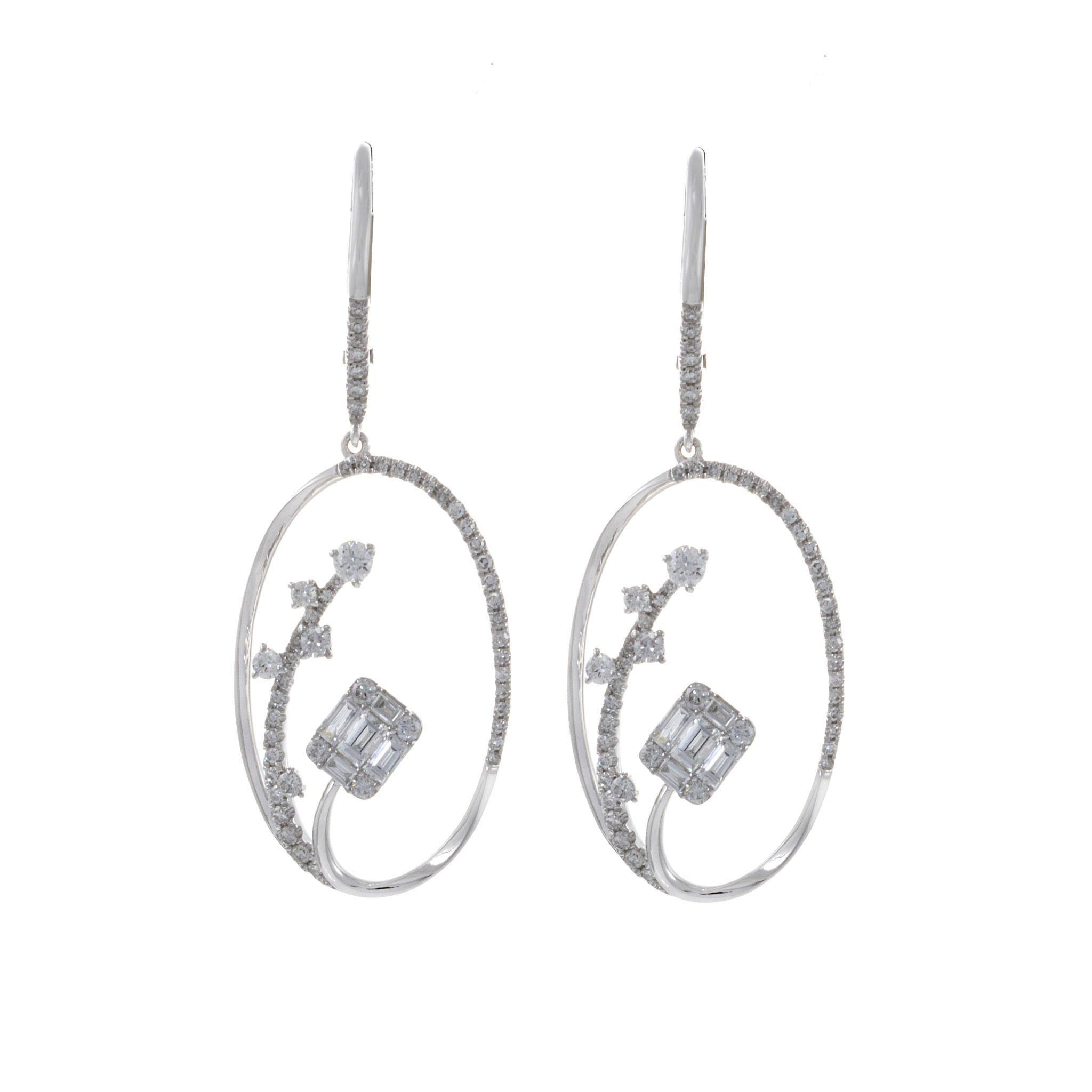 Introducing these stunning 14KT white gold round and baguette oval drop earrings, a true embodiment of timeless glamour. The earrings feature a total of 1.00 carat weight of round brilliant and baguette cut diamonds meticulously set to create an
