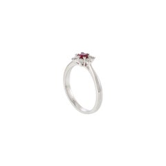 14KT White Gold Round Cut Diamond and Ruby Center Starburst Ring
