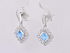 14KT White Gold Round Diamond & Swiss Blue Topaz Princess Halo Drop Earrings