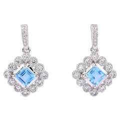 14KT White Gold Round Diamond & Swiss Blue Topaz Princess Halo Drop Earrings
