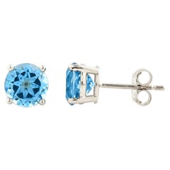 Orecchini con perno solitario in oro bianco 14KT con Topazio Blu svizzero rotondo