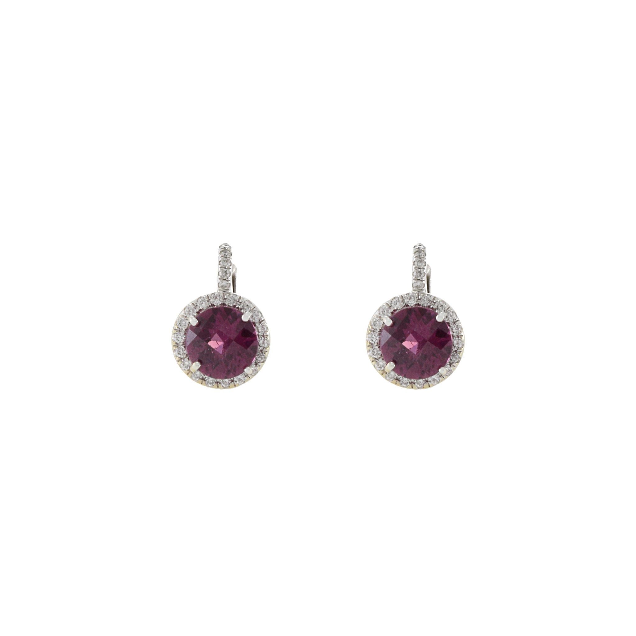 14KT white gold earrings featuring 3.28CT of round cut rubellite tourmaline and 0.50CT-TW round cut diamonds. The beautiful craftsmanship, combined with the stunning gems, make these 14KT white gold earrings a stunning addition to any ensemble.
