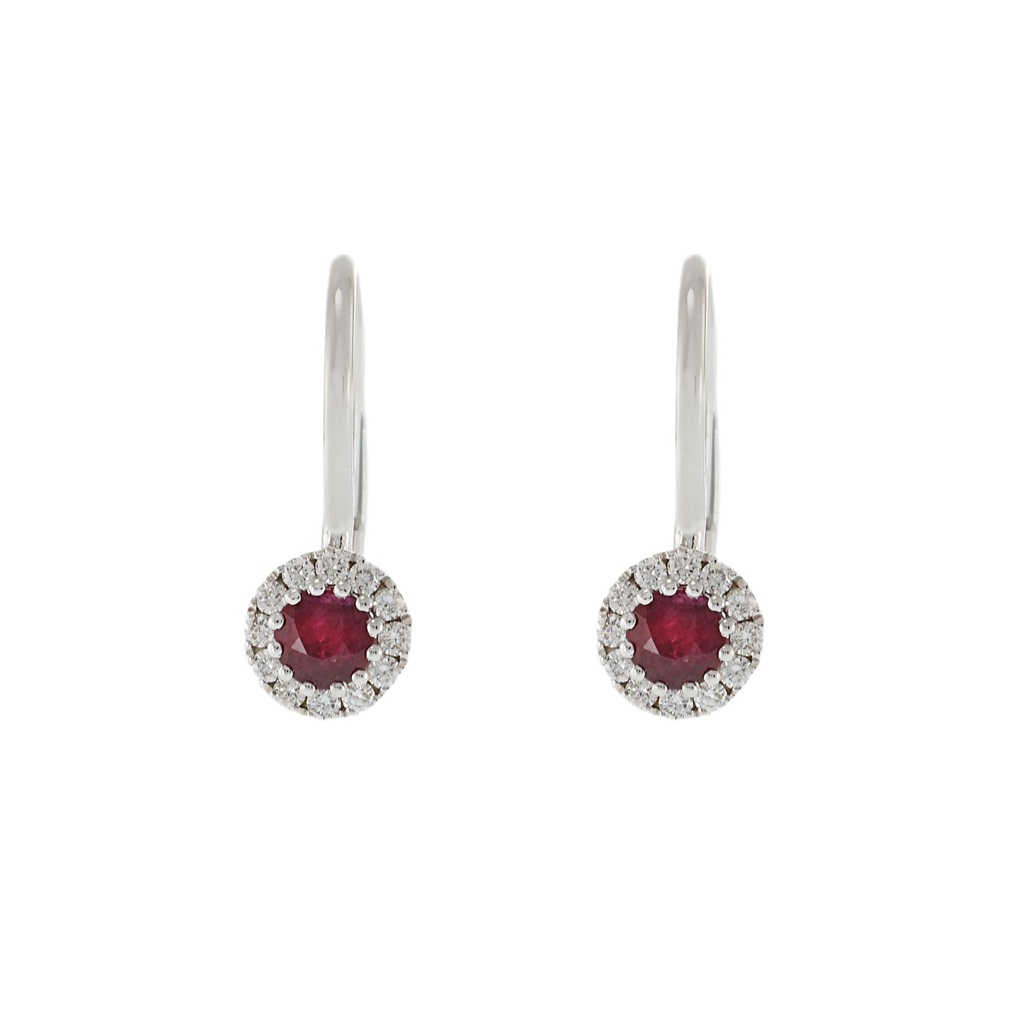 Step out in style and elegance with our exclusive 14KT white gold huggie earrings. Adorned with brilliant round cut diamonds totaling 0.17 carats and stunning round rubies totaling 0.44 carats, these earrings will make you stand out in any crowd.