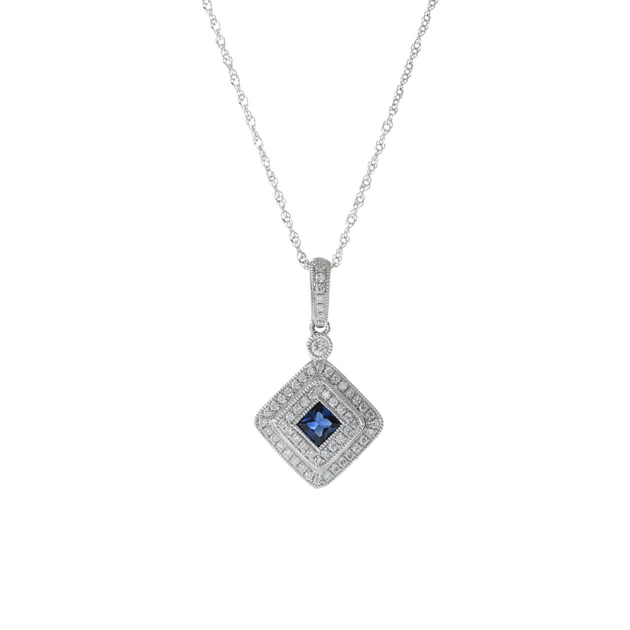This 14KT white gold pendant is an exquisite piece of jewelry, featuring a square-shaped genuine blue sapphire with a weight of 0.25 carats. The sapphire is elegantly surrounded by round-cut diamonds, with a combined weight of 0.19 carats. This