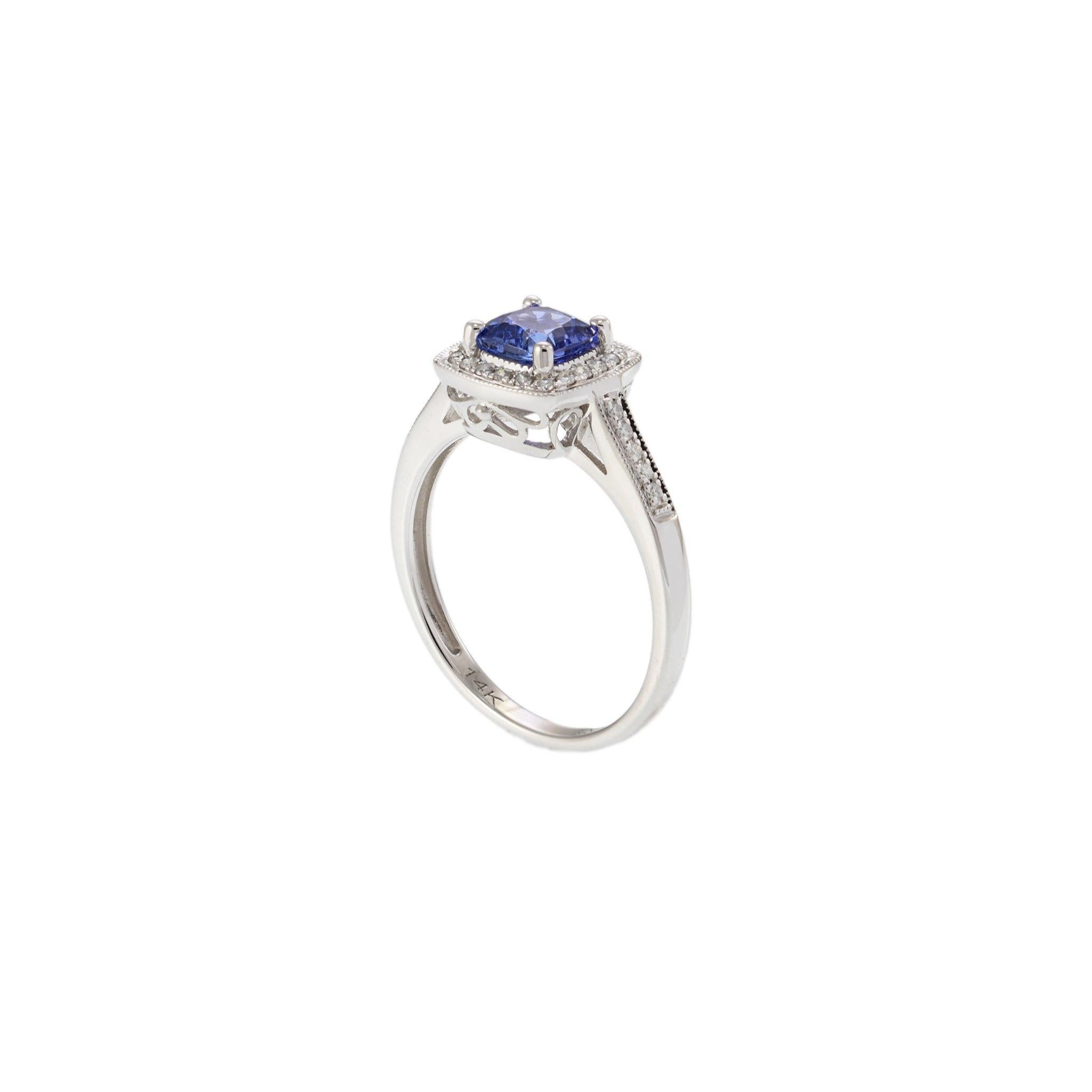 Modern 14KT White Gold Tanzanite and Diamond Halo Ring For Sale