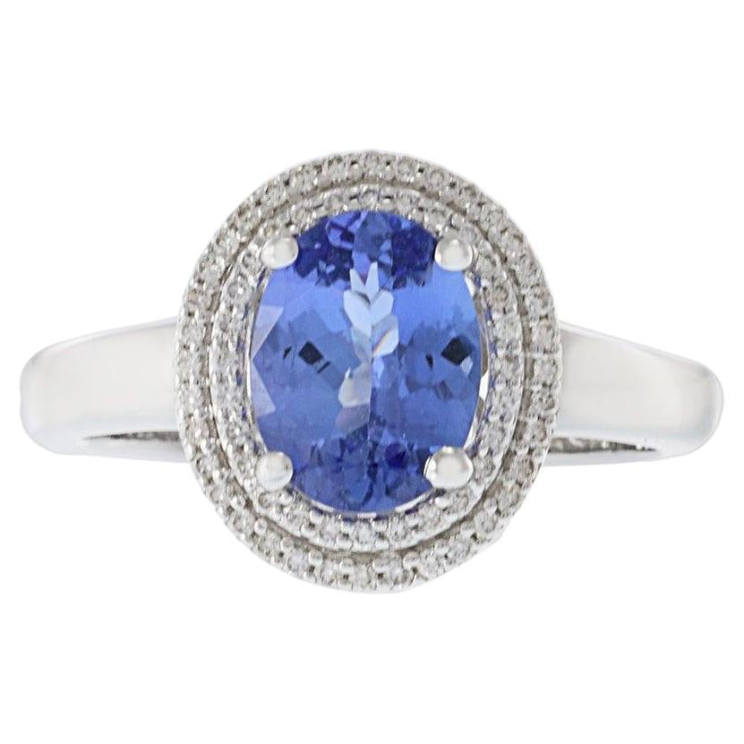 Anillo Halo de Tanzanita y Diamante de Oro Blanco de 14 KT