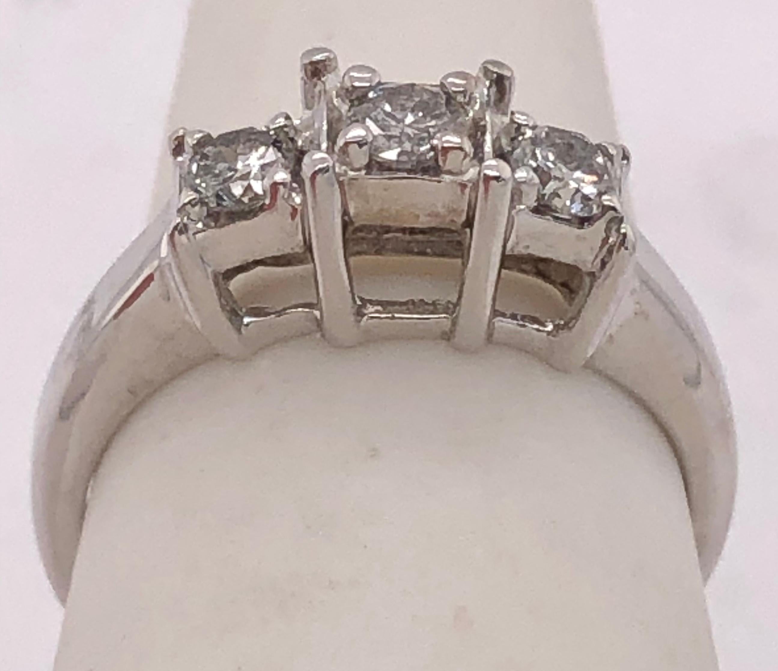 14Kt White Gold Three Stone Ring 0.20 Total Diamond Weight
Size 4.5 with 2.18 grams Total weight