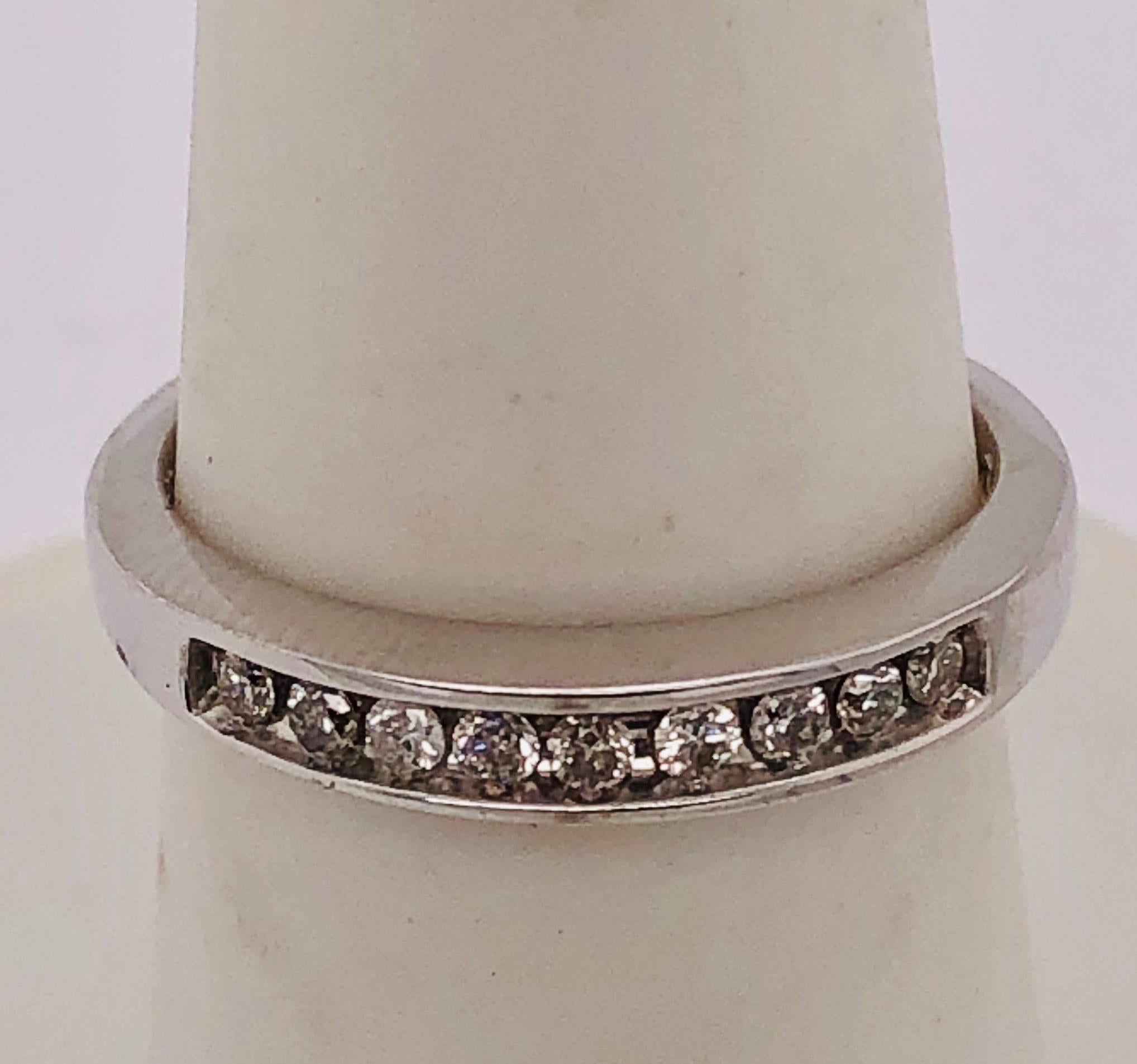 14Kt White Gold Band Ring with Diamonds 0.45 Total Diamond Weight
Size 6.75 with 2.90 grams Total weight

