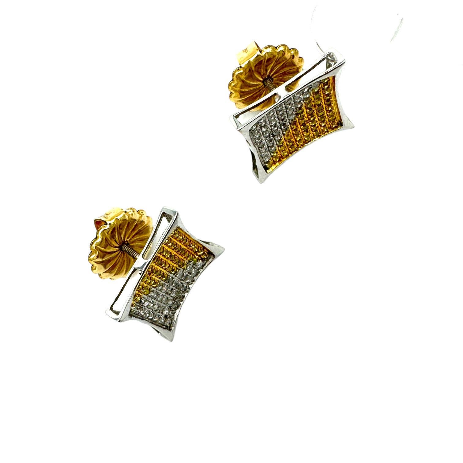 These dynamic pave diamond earrings feature yellow and white diamond set stones; yellow and white are in a tri-angle shape in a secure outer bezel. The pave setting measures 13mm in diameter and are .50 carat in total diamond weight. The post is a
