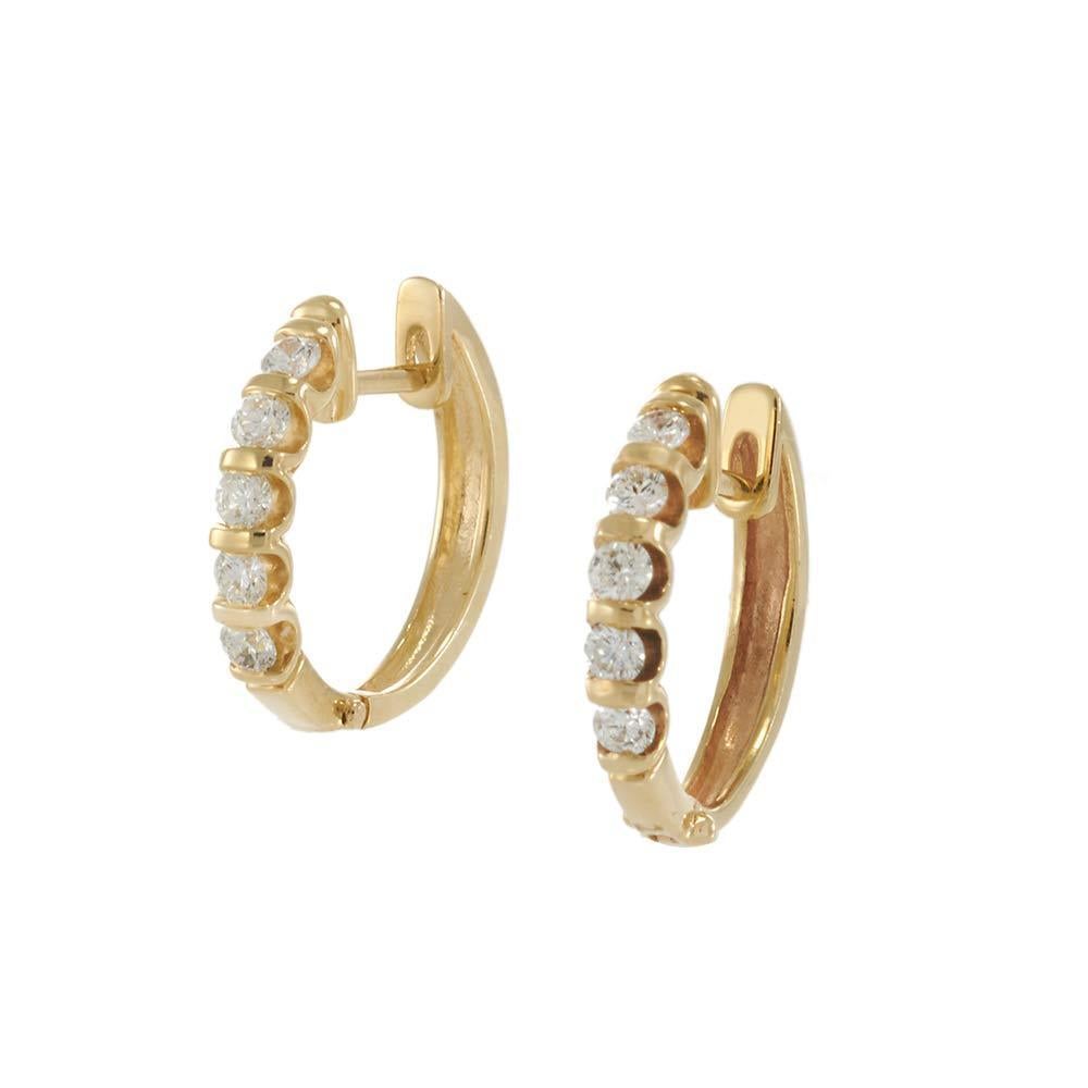 These 14KT yellow gold huggie earrings deliver timeless sparkle in a compact, wearable silhouette. Set with a row of round-cut diamonds totaling approximately 0.50 carats, each 15mm hoop curves gently around the earlobe, offering secure comfort and