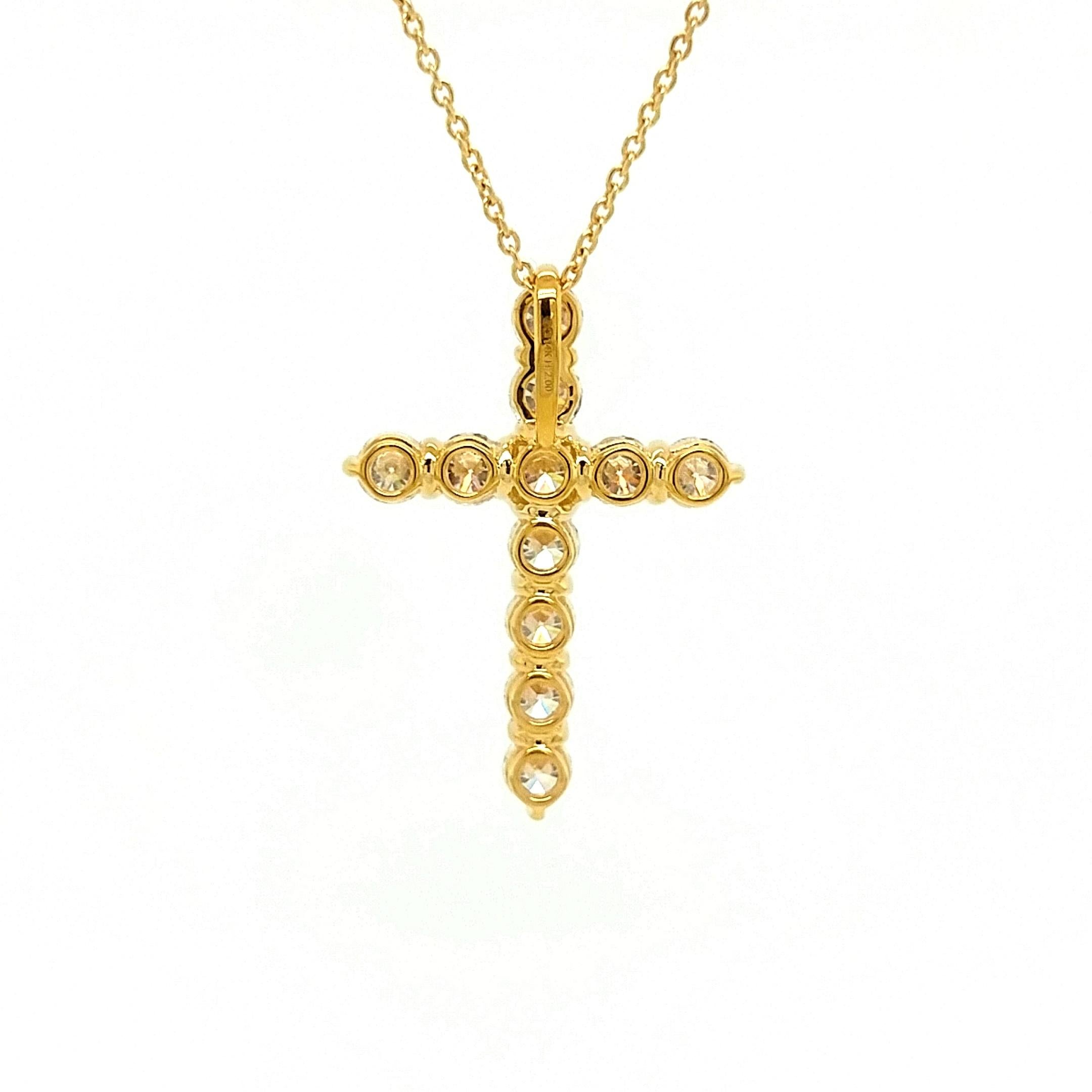 A beautiful yellow gold, diamond cross pendant necklace. A classic cross pendant set with 11 round brilliant cut diamonds All the stones are prong set. The total diamond weight is 2.00 carat. The diamonds are H-I color and SI1/SI2 clarity. The