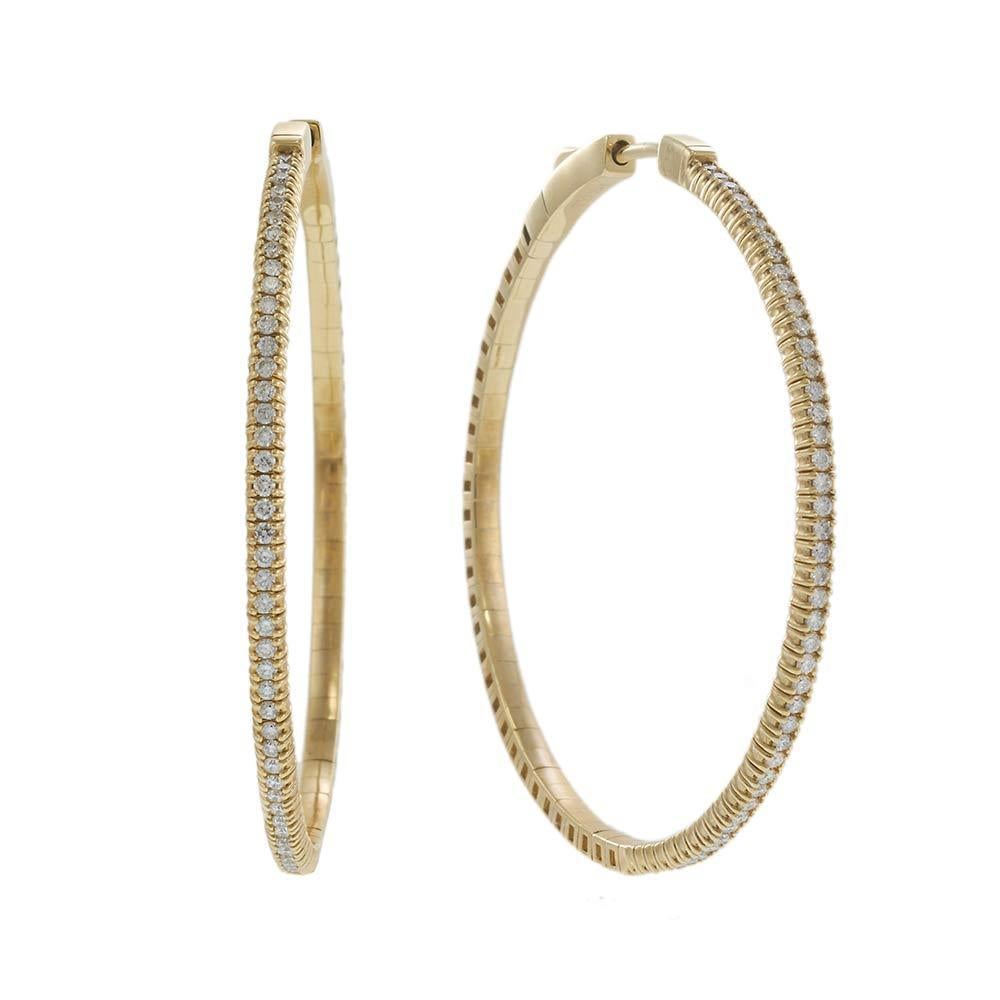 A bold update on the timeless hoop, these 14KT yellow gold earrings feature a flexible design and a full front of sparkling round brilliant diamonds totaling approximately 0.70 carats. The 45mm diameter offers a statement silhouette, while the G-H
