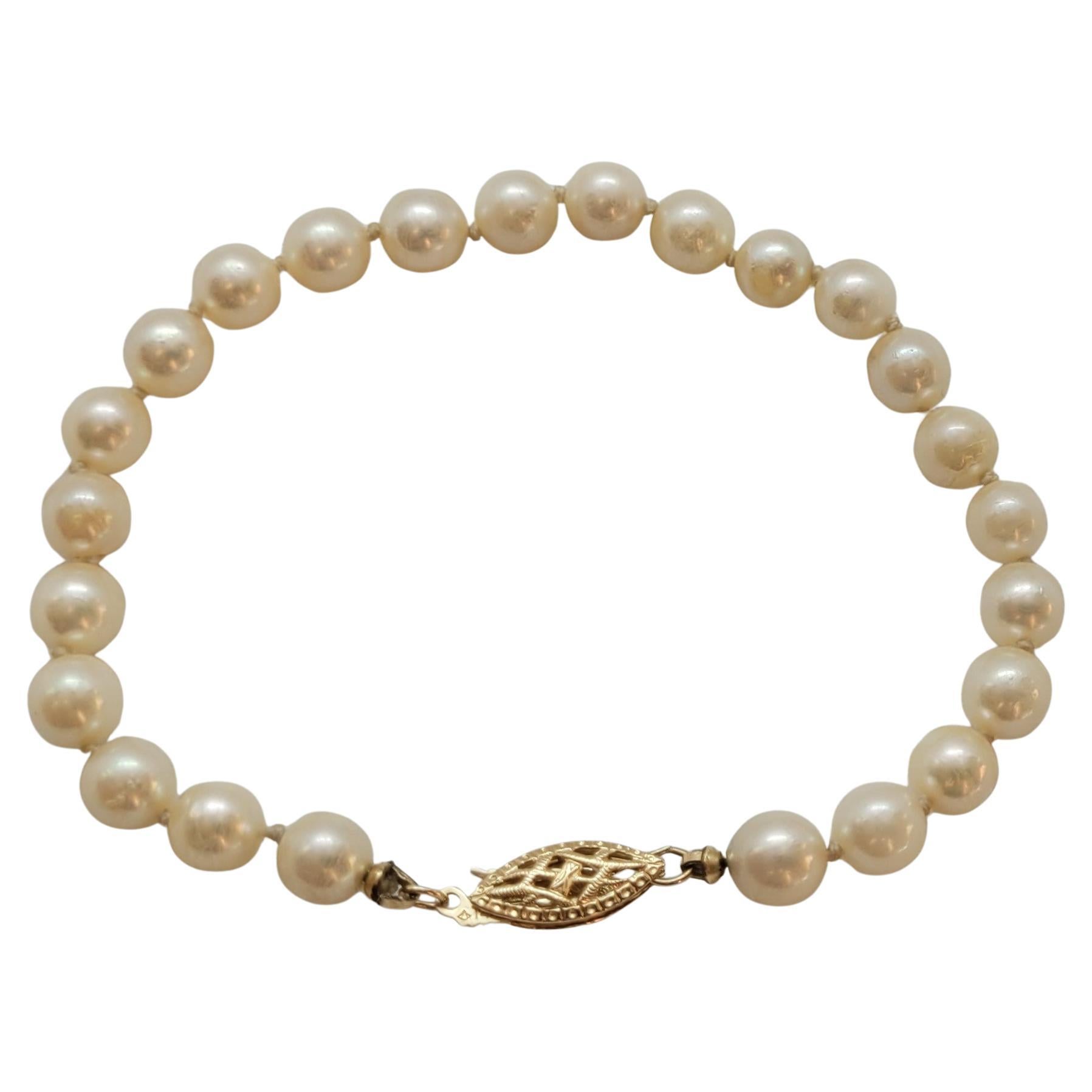 14kt Yellow Gold 7mm Cultured Pearl Bracelet, Knotted, 7 Inches, Golden Cream