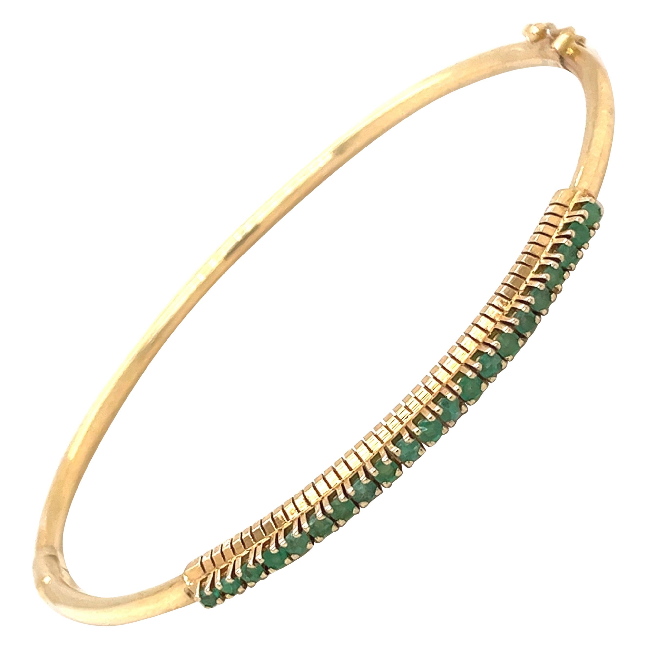 14kt Yellow Gold and Emerald 0.90ct. Bangle Bracelet