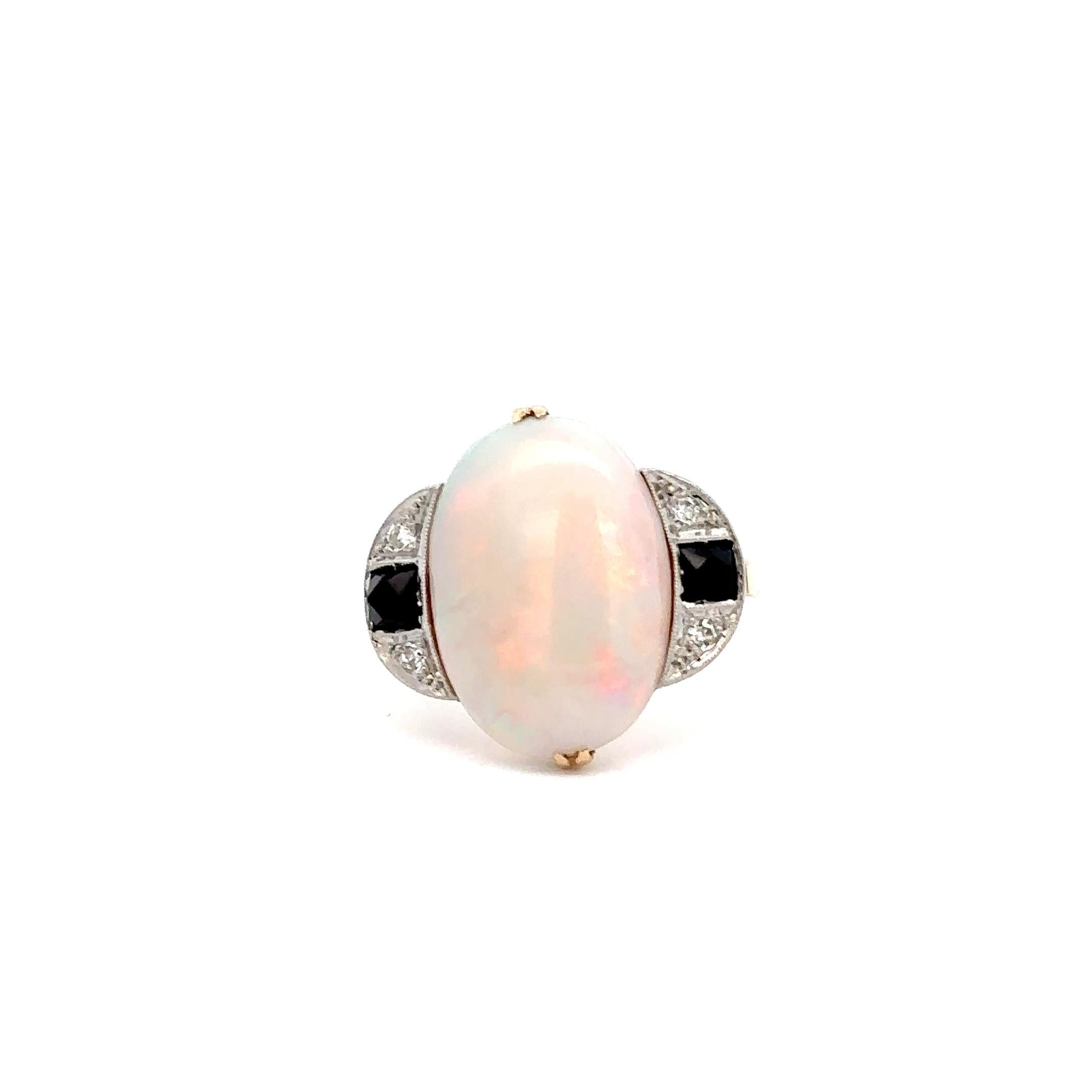 14KT Yellow Gold and platinum Antique Victorian Era Genuine Australian Opal And Diamond Ring with black onyx featuring 0.12CT-TW single cut diamonds. An impressive heirloom piece crafted with intricate detail for a timeless design. High-grade metals