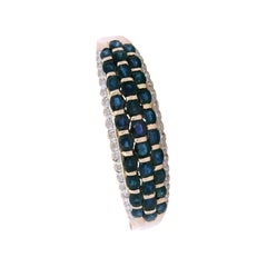 14kt Yellow Gold Bangle Bracelet with 13.0 CTW in Blue Sapphires 
Diamonds