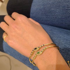 14 Karat Gold Bangle Bracelet with.85 Carat Emeralds and .33 Carat Diamonds