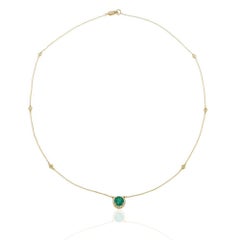 14KT Yellow Gold Bezel Set Diamond Station Necklace with Emerald and Halo