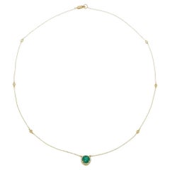 14KT Yellow Gold Bezel Set Diamond Station Necklace with Emerald and Halo