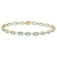 14KT Yellow Gold Bezel Set Oval Blue Topaz Bracelet