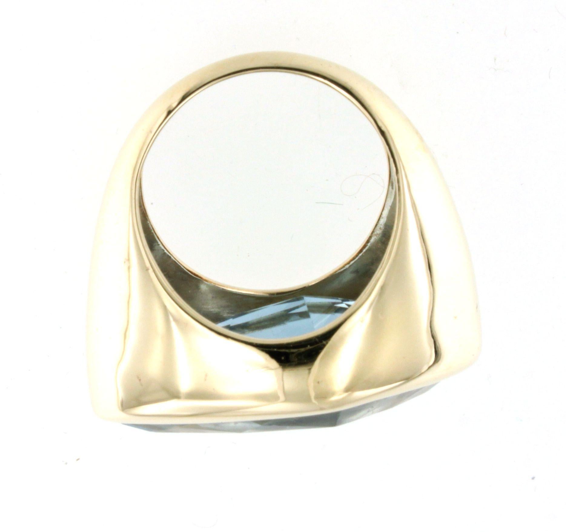 Fashion modern cocktail ring in 14kt yellow gold with blue topaz stone  handemade in Italy by Stanoppi Jewellery since 1948.  The stone is a real novelty, designed by the stylist Gisella for her new jewels of the spring-summer 2025 collection   I