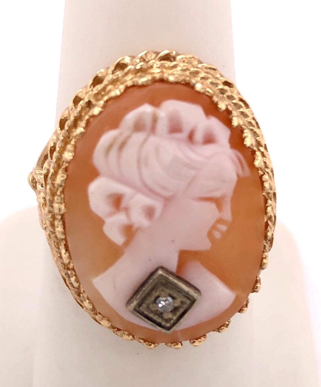 14KT Cameo Ring with Round Diamond. 6.75 size with 6 grams total weight.
