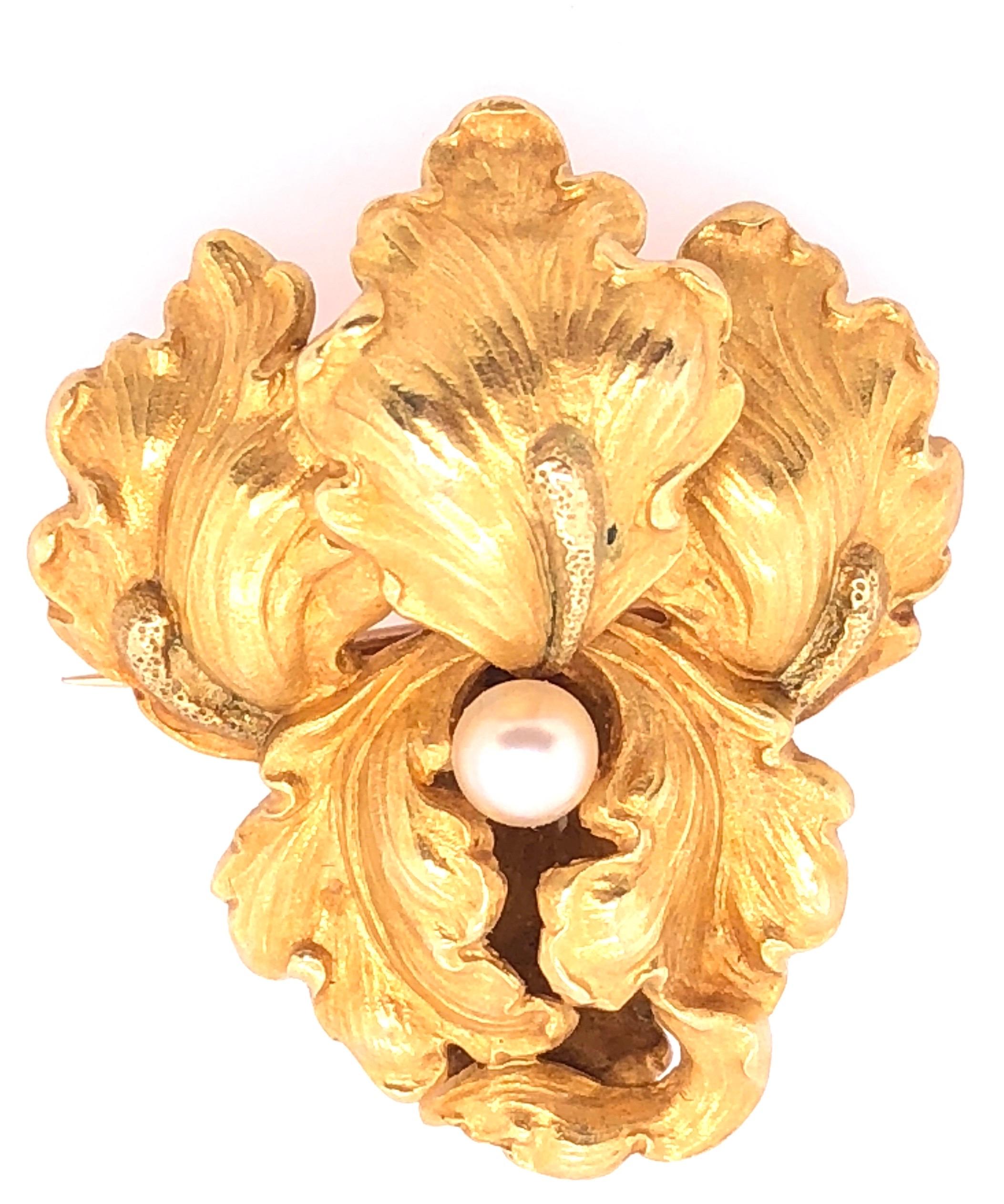 14Kt Yellow Gold Catleya Pin with Center Pearl. The pin table measures 30.5mm by 26.5mm. Pearl measures 4.6mm. This vintage estate collection piece is simply stunning. 