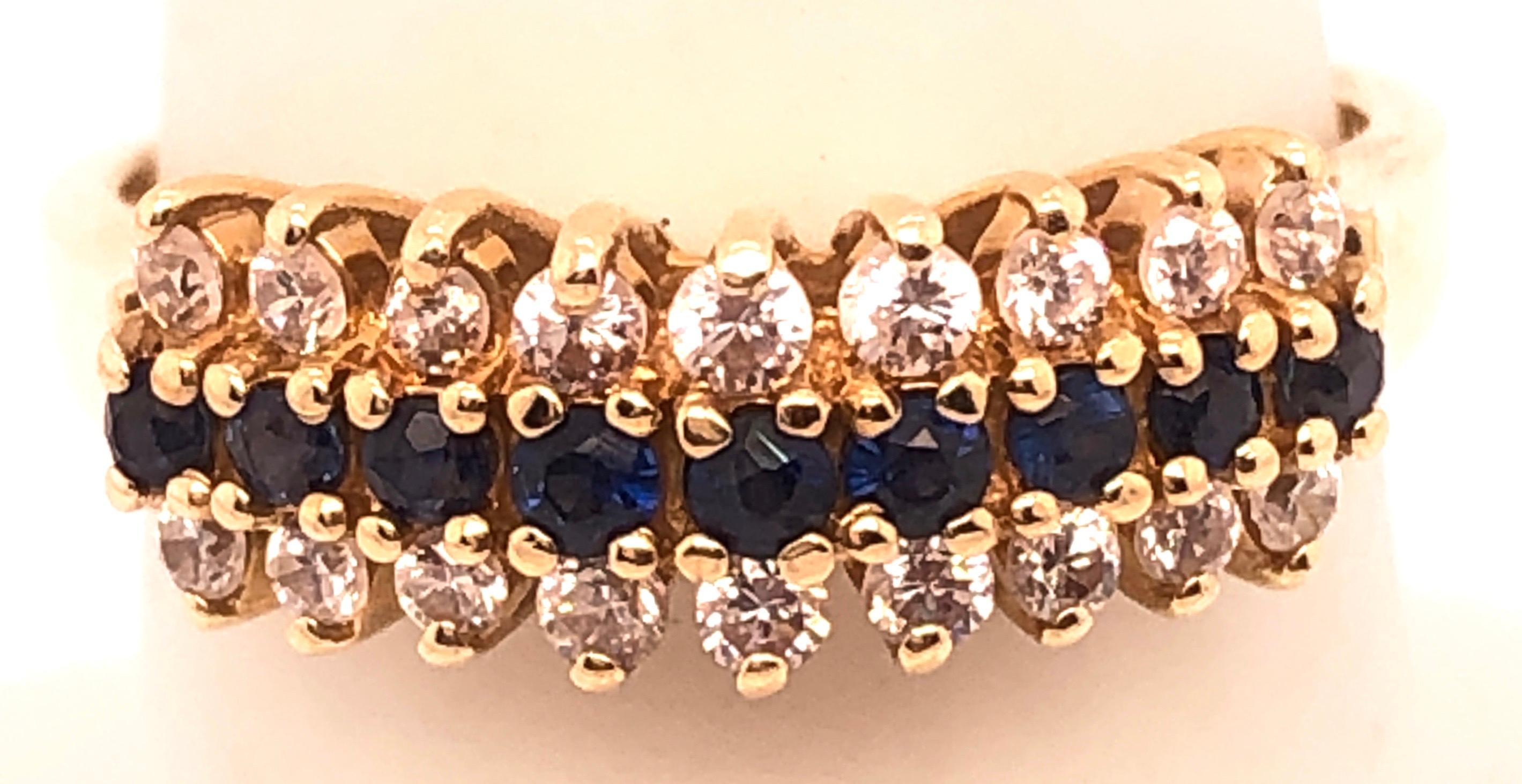 Round Cut 14 Karat Yellow Gold Contemporary Ring with Sapphire and Diamond For Sale